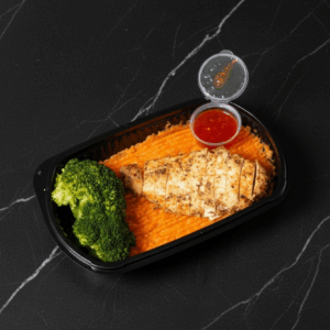 Butterfly Cajun chicken, sweet potato mash and a serving seasoned broccoli florets.