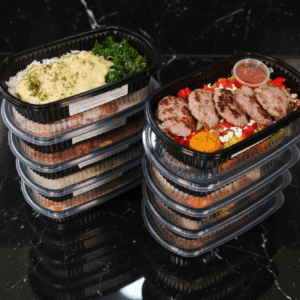 10 meal prep boxes with two boxes open with a meal